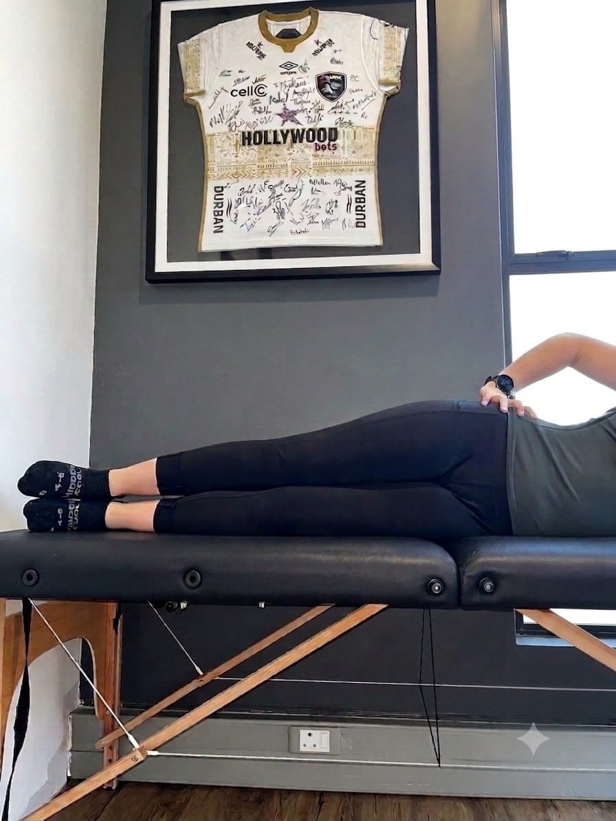 Hannah demonstrating the starting position of side-lying hip abduction