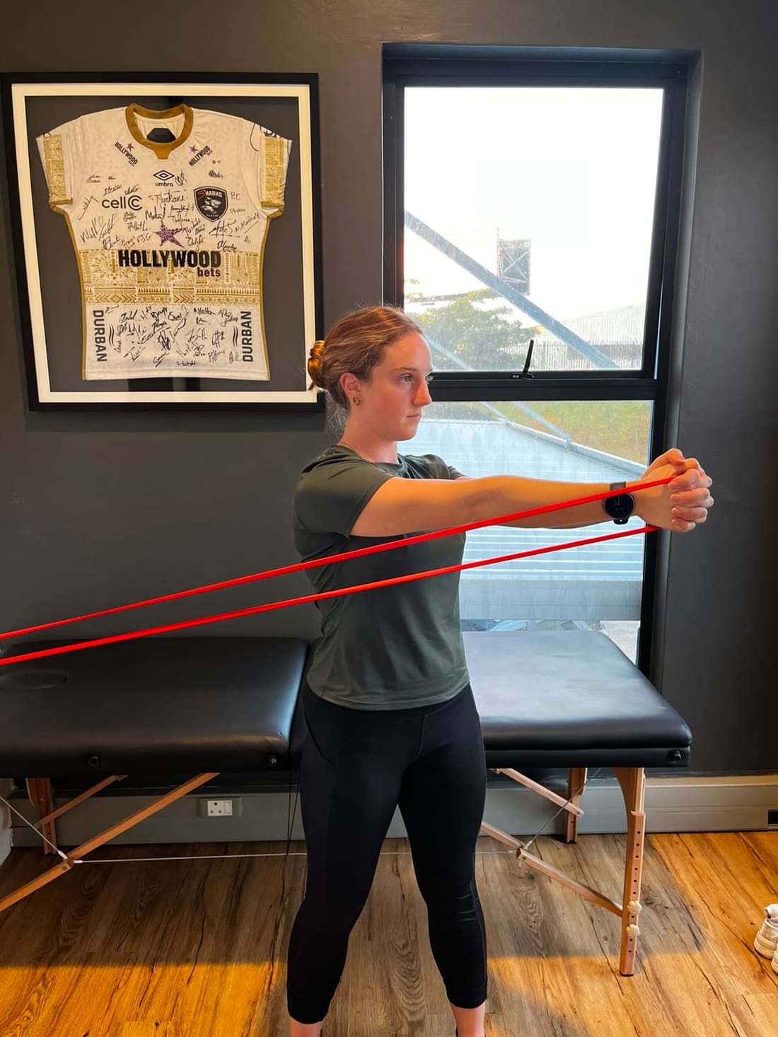 Hannah demonstrating the extended position of a Pallof press